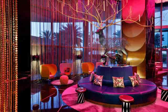 Farrago lobby lounge at W Dubai featuring bold decor, perfect for upscale networking receptions.