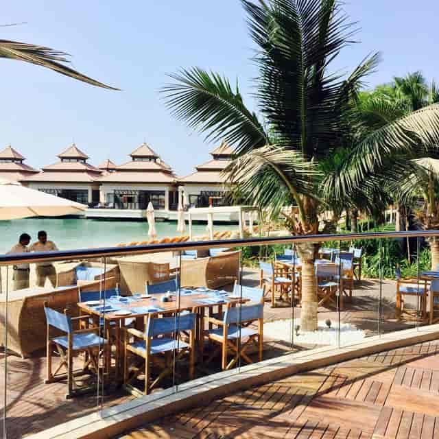 Luxury waterfront dining at The Beach House, Anantara The Palm, for executive retreats and events.