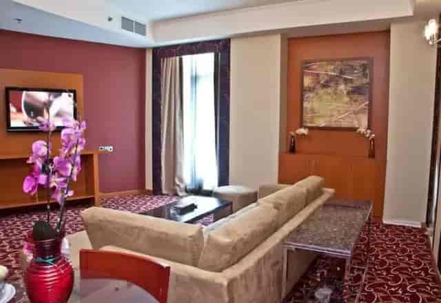 Ramee Rose Hotel suite with patterned carpet for VIP meetings and corporate breakout sessions.