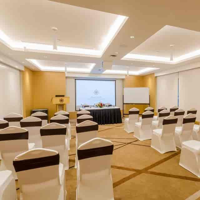 Executive Lounge theater-style meeting room with AV setup for corporate events and conferences.