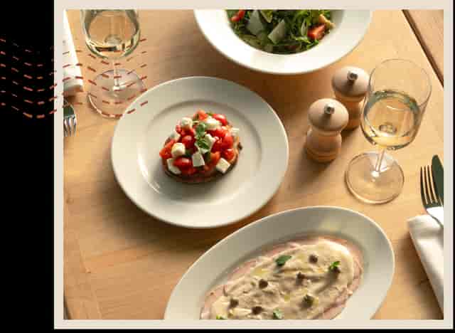 Minimalist table setting at Lolli Restaurant, The Palm, for upscale networking or executive dinners.