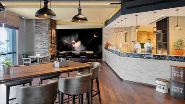 Modern breakout space at Hyatt Regency Dubai, ideal for corporate networking and team conferences.