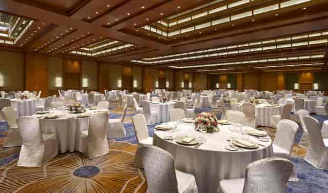 Large ballroom at The Ritz-Carlton Dubai for gala dinners and corporate conferences.