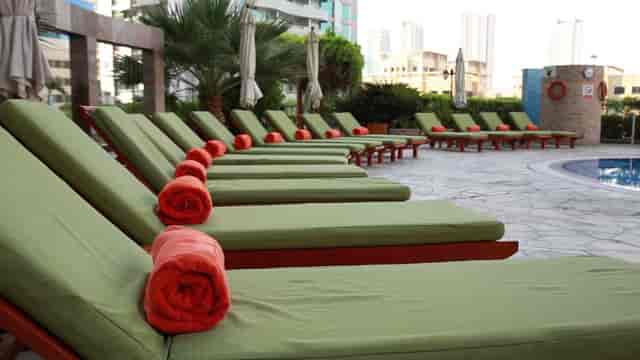 Poolside lounge at TIME Oak Hotel & Suites, ideal for incentive group events and breakout sessions.