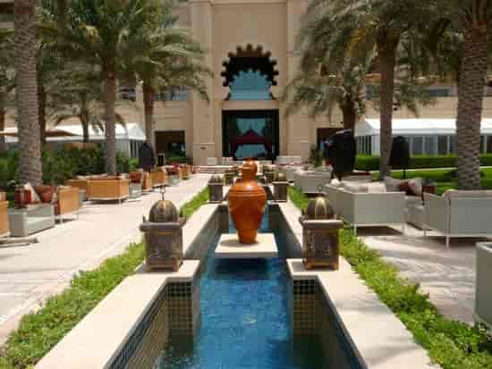 Fairmont The Palm Courtyard: Luxury outdoor networking space with water features for event hire.