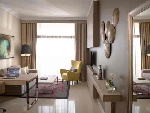 Modern executive guest room at Two Seasons Hotel for corporate events and business meetings.