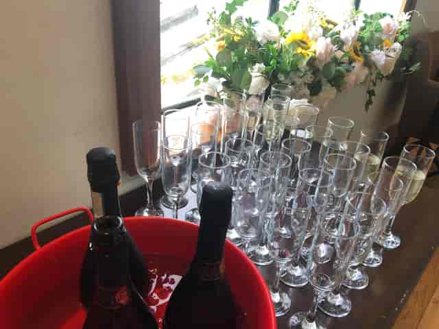 Beverage station with champagne in Emerald Room at Emerald Venues for luxury corporate event.