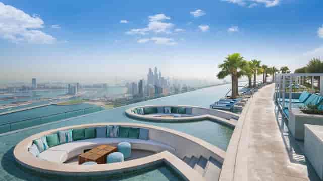 Rooftop library at Address Beach Resort with infinity pool and skyline views, perfect for events.