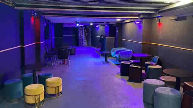 Club No8 lounge venue with ambient lighting for intimate networking mixers and afterparties.