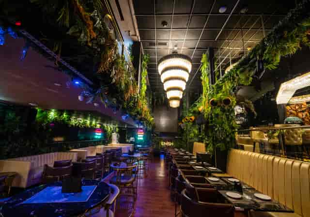 Stylish event space with lush greenery at The Terrace - Glow Lounge, ideal for celebrations.