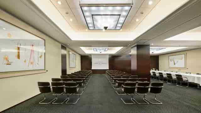 Boardroom at Athenaeum Conference Centre with integrated AV for hybrid meetings and presentations.