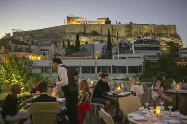 Rooftop restaurant at Royal Olympic Hotel with Acropolis view for corporate incentive dinners.