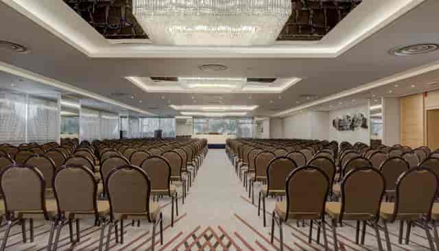 Ilissos Meeting Room: Theater-style plenary space for corporate keynotes and large presentations.