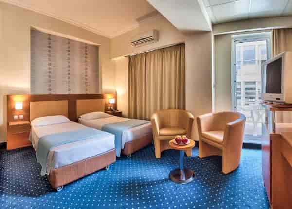 Twin guest room at Athens Cypria Hotel for conference accommodation and budget business travel.