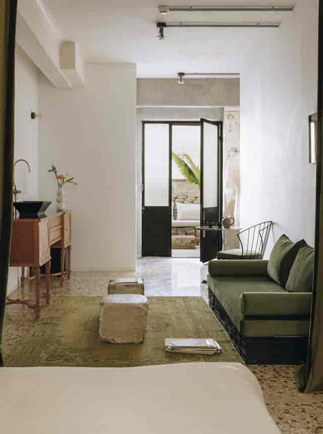 Minimalist VIP green room at Mona Athens for luxury site inspections and client consultations.