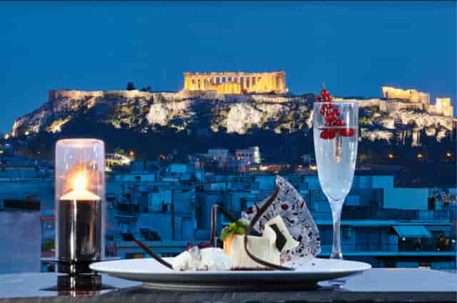 Zeus restaurant in Wyndham Grand Athens featuring premium corporate event dining with Acropolis view.