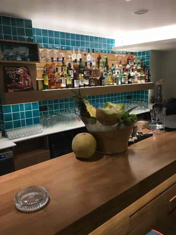 Luxury hotel bar setup with glassware for corporate reception and event catering.