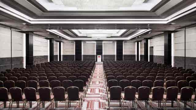 Theater-style Grand Hall conference room for corporate events and keynote presentations.