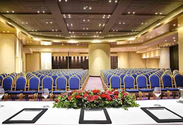 Uranus Terrace hotel ballroom with theater seating for corporate plenary or keynote event.