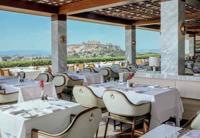 The Atrium rooftop venue at GB Roof Garden with Acropolis view for luxury corporate events.