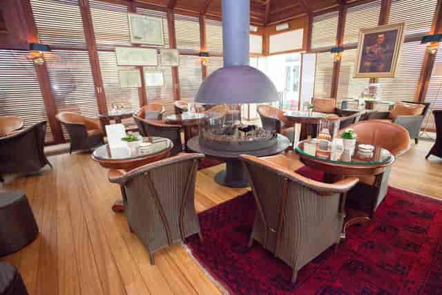 Alexander's Cigar Lounge with high-backed chairs, perfect for corporate networking and events.