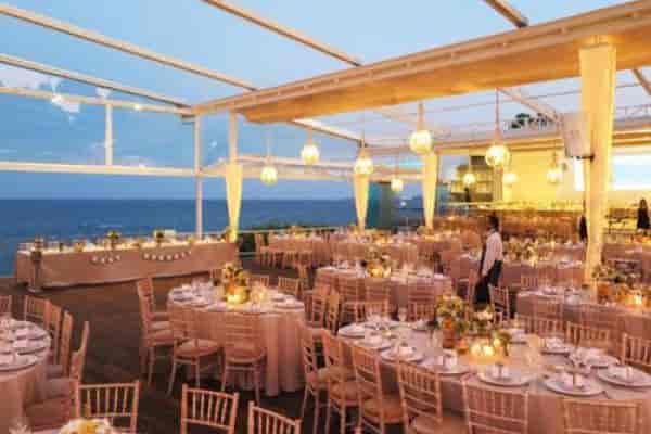 En Lefko outdoor wedding venue with panoramic ocean views and weather-proof design.
