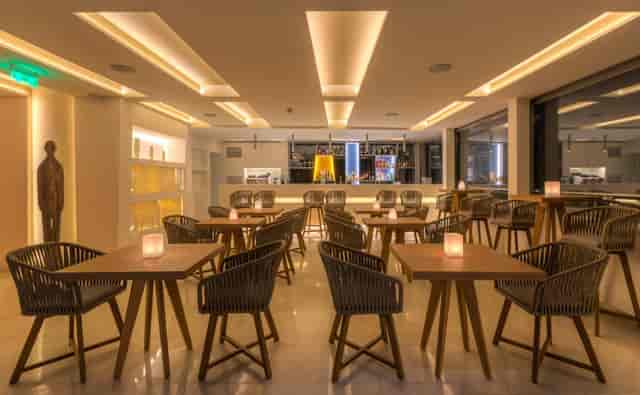 Thea Terrace Bar: Modern lounge space for professional networking and cocktail events.