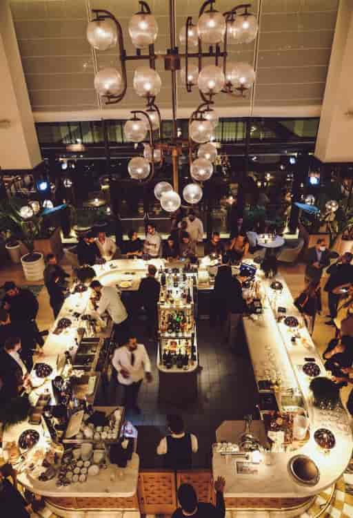 U-shaped bar at Four Seasons Astir Palace, ideal for corporate networking and conference receptions.
