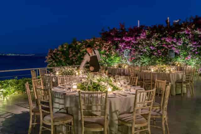 C Lounge gala dining: waterfront evening reception with elegant table styling and uplighting.