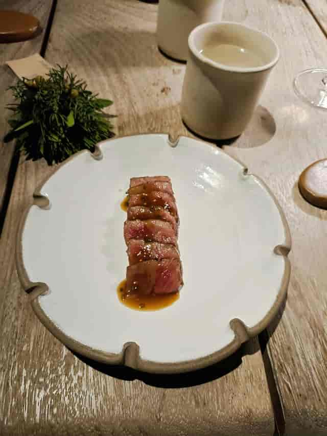 Minimalist protein plating at Soil Restaurant for executive dinner or premium gala events.