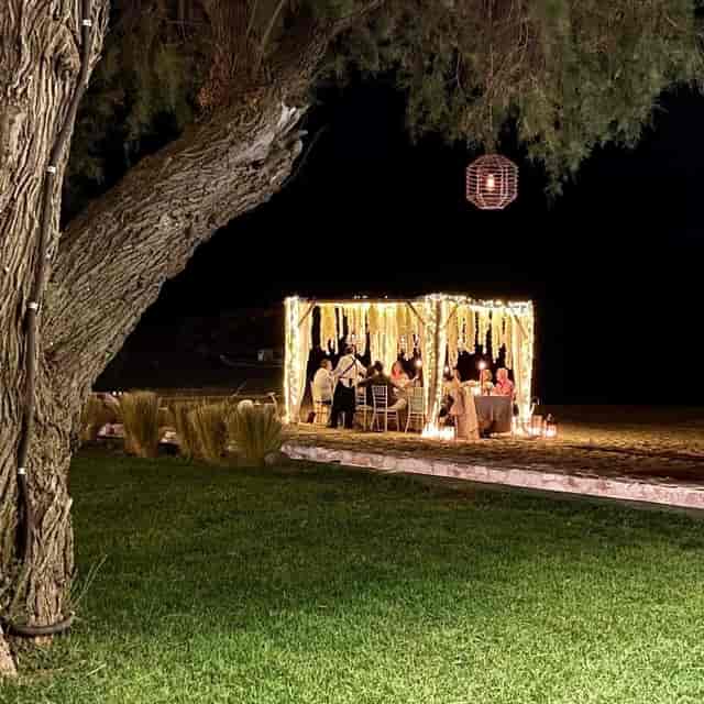 Private dining at Reef Athens Riviera: bespoke lounge venue for luxury events and beach weddings.