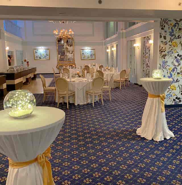 Copperfields Hall banquet setup with globe lighting for elegant wedding and corporate receptions.