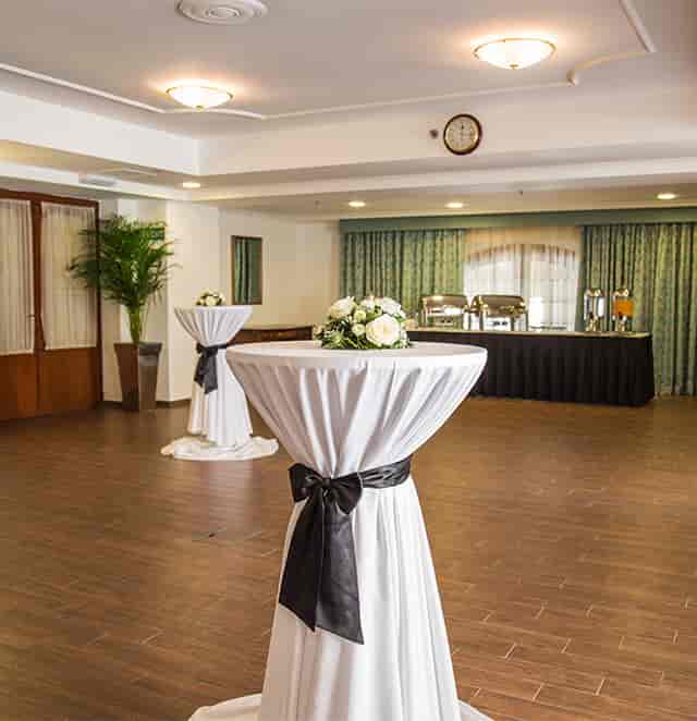 William Shakespeare Suite event setup with cocktail tables, floral decor, corporate gala or party.