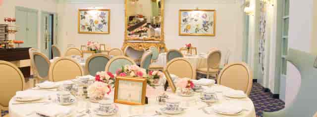 High-tea table setup at Victoria Hotel with floral centerpieces for intimate social event styling.