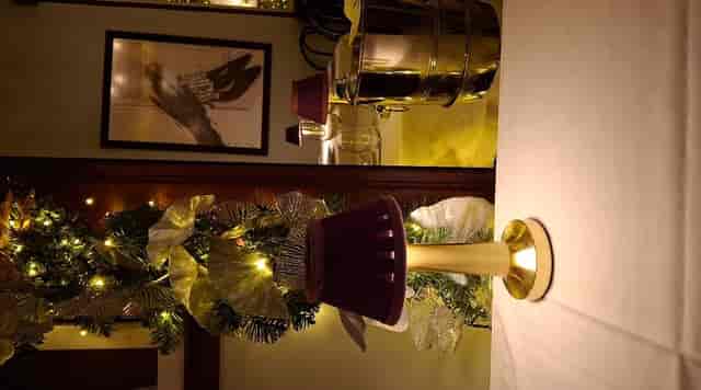 Elegant Maison Colette gala dinner table setting with ambient accent lighting.