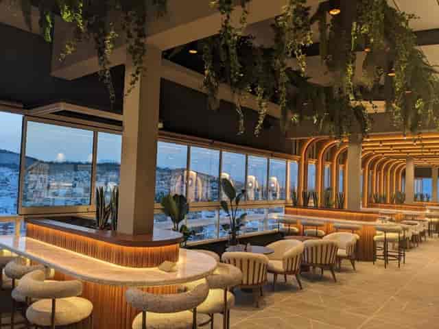 Upscale cocktail reception venue at Deos Athens with biophilic design and panoramic views.