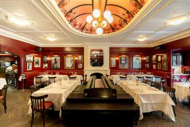 Private dining room at Rick's American Steakhouse with banquette seating for business events.
