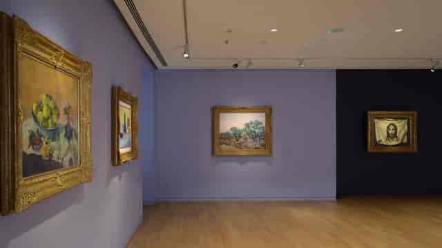 VIP reception gallery with track lighting, perfect for exclusive corporate networking events.