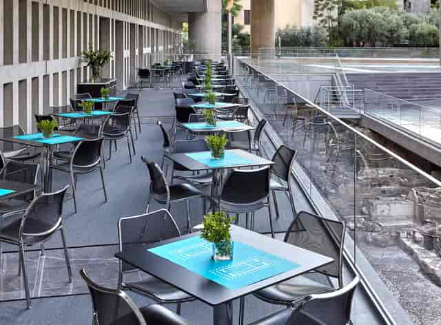 Modern outdoor terrace seating at Acropolis Museum for corporate breakout and networking events.