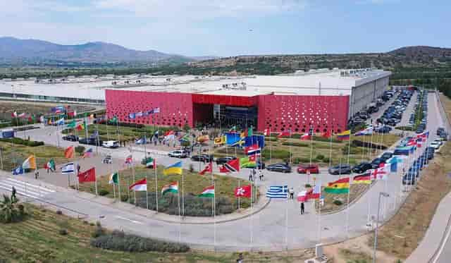 Metropolitan Expo exhibition hall with global flags for international summit or conference venue.