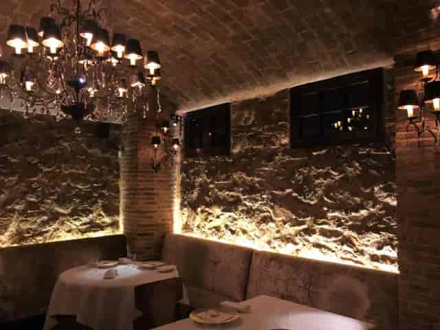 Spondi dining room with statement chandelier for intimate VIP dinners and executive events.