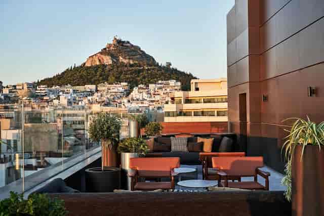 Rooftop terrace in Athens with Mount Lycabettus view for VIP cocktail receptions and networking.