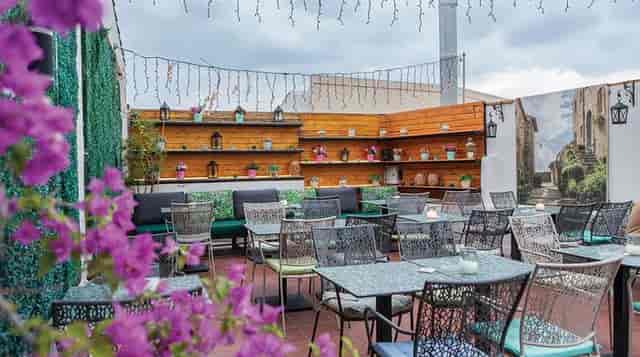 Rooftop bistro seating at L'Amiral for networking mixers and evening receptions.