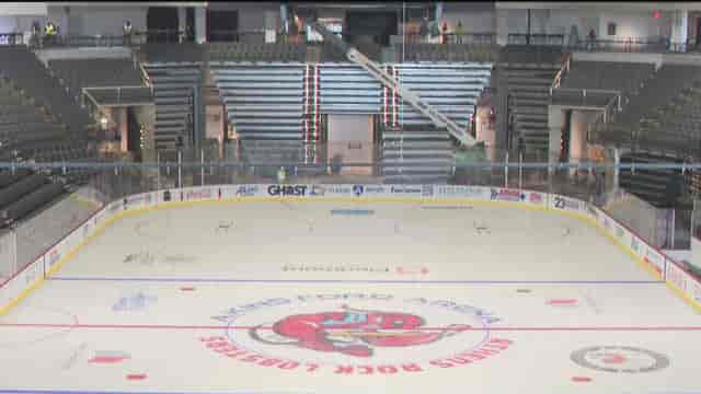 Akins Ford Arena interior during floor conversion for large-scale event production.