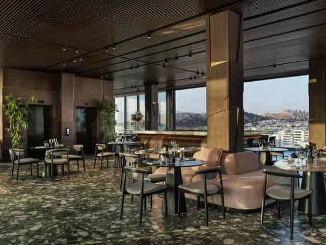 Luxury rooftop venue for corporate networking and VIP reception with panoramic architectural views.