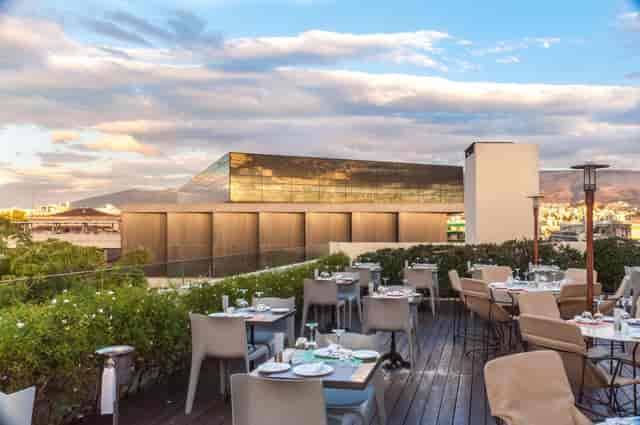 Rooftop restaurant in Trinidad with sunset views, ideal for networking dinners and corporate events.