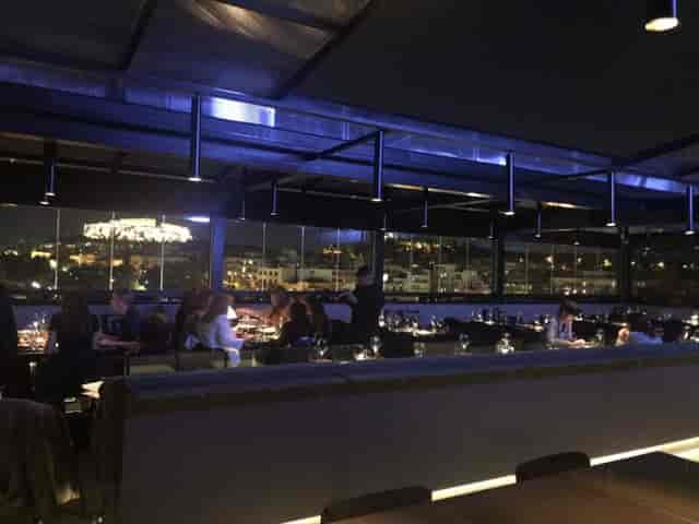 Rooftop restaurant with Acropolis view for corporate events and VIP dinners.