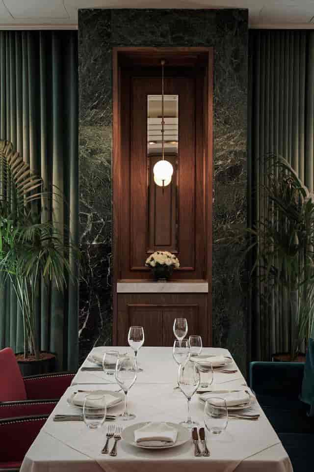 Luxe Athenee Athens bar with wood decor for private dining and VIP networking events.