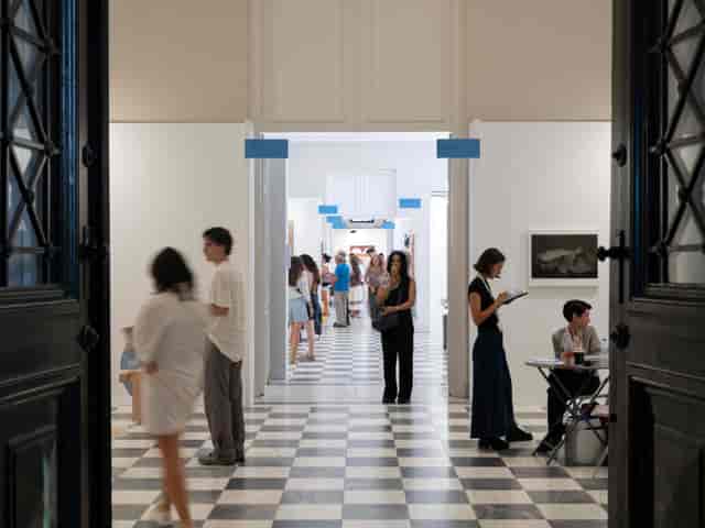 Mets Arts Centre gallery with clear signage and registration desk for event venue rental.