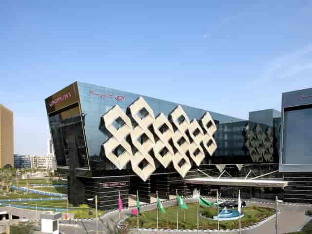 Modern geometric exterior of Ibn Batouta at Crowne Plaza Riyadh for luxury corporate conferences.